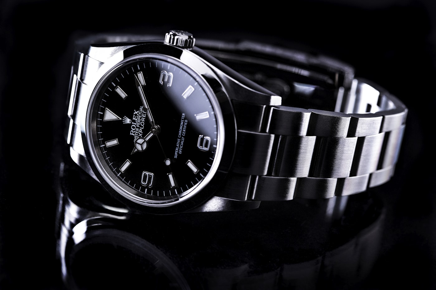 Steel Rolex sports watch with a black dial